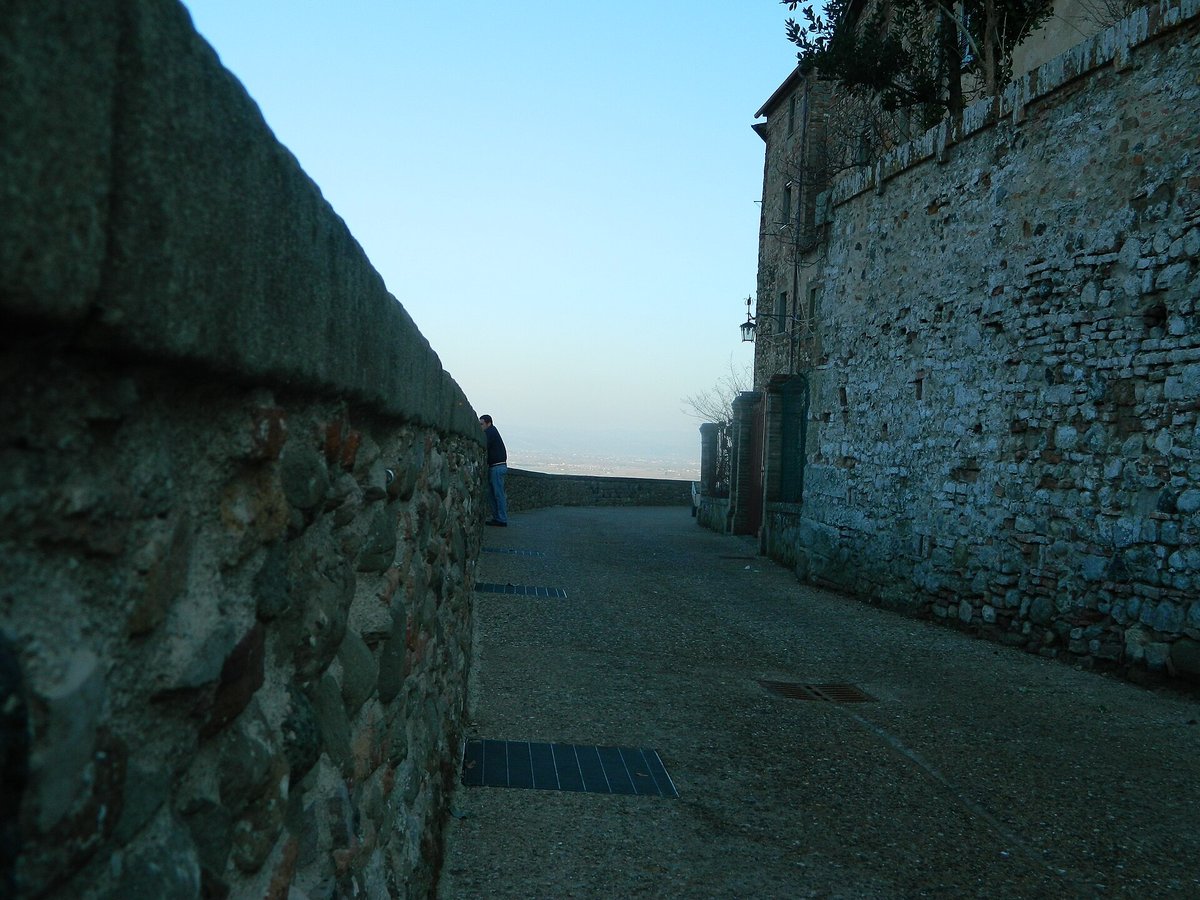 The great stone town wall of Anghiari above the plain