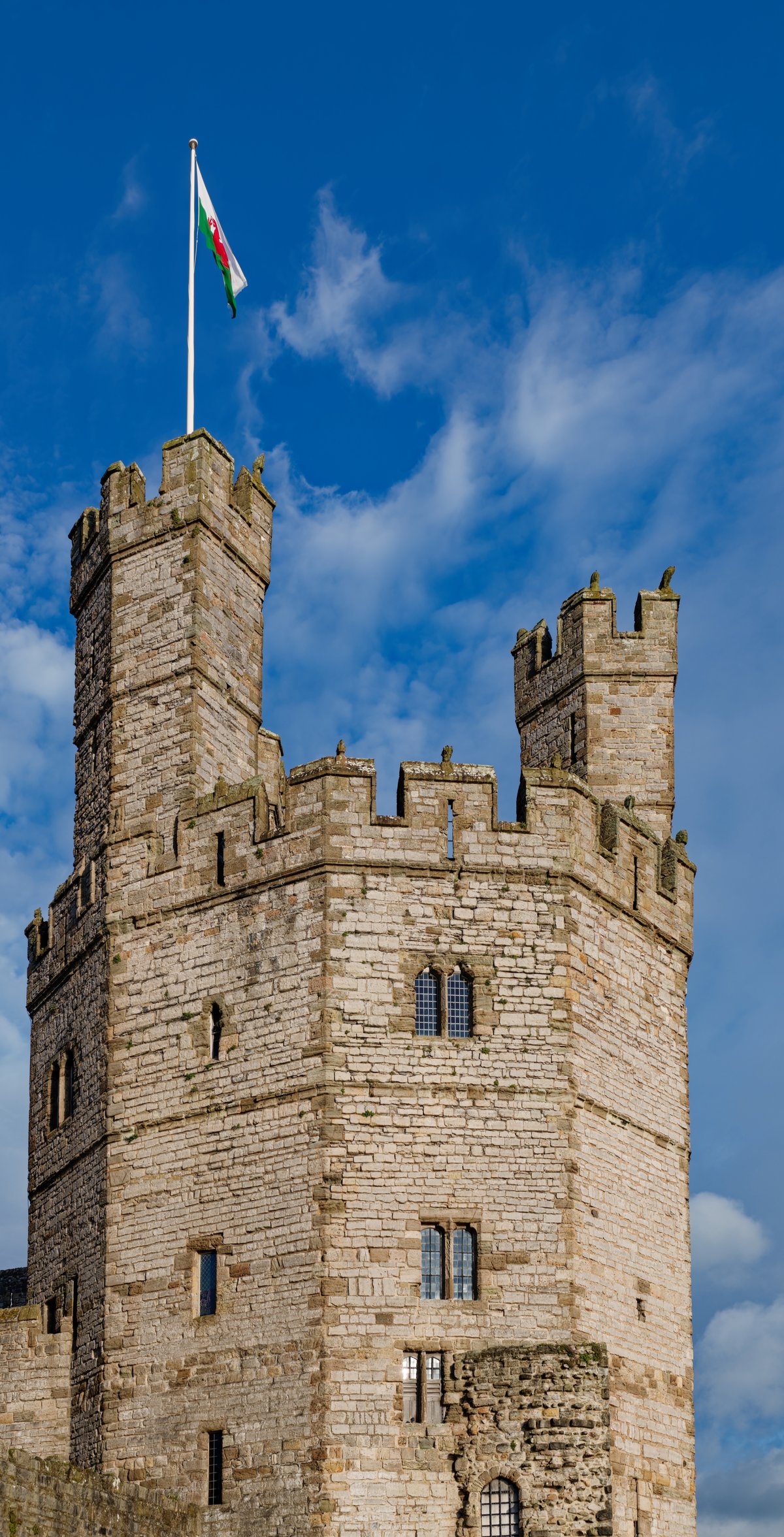 The Eagle Tower of Caernarfon Castle, a faceted polygonal tower with banded stonework and turrets