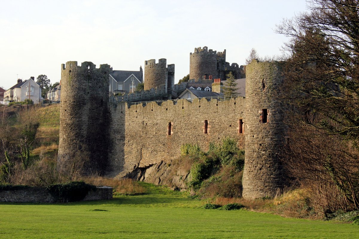 Conwy Castle in Wales, its eight round towers strung along a rock above the estuary