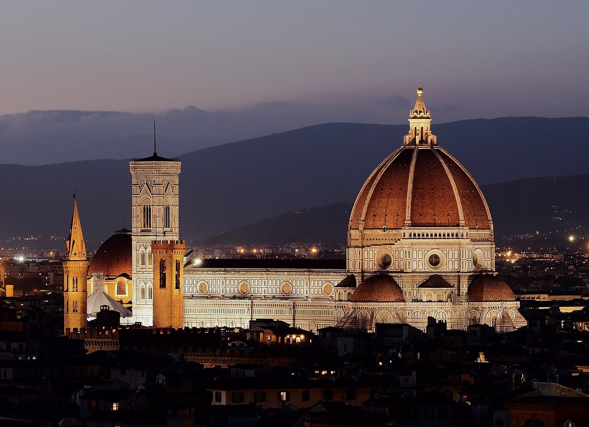The dome of Florence Cathedral floodlit at dusk