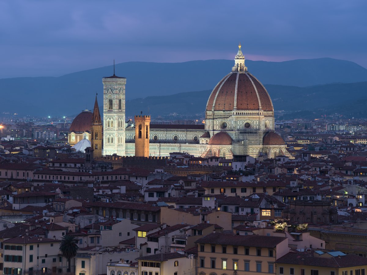 Brunelleschi's dome and Giotto's campanile rising over the rooftops of Florence, seen from Piazzale Michelangelo