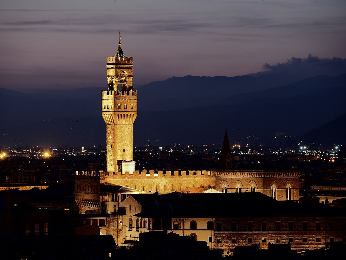 The tower of the Palazzo Vecchio floodlit at dusk