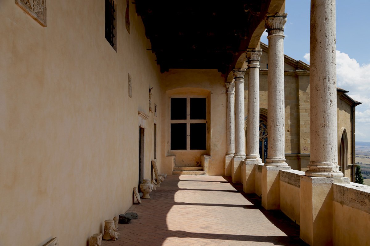 Warm afternoon light in the loggia of the Palazzo Piccolomini in Pienza, open to the valley