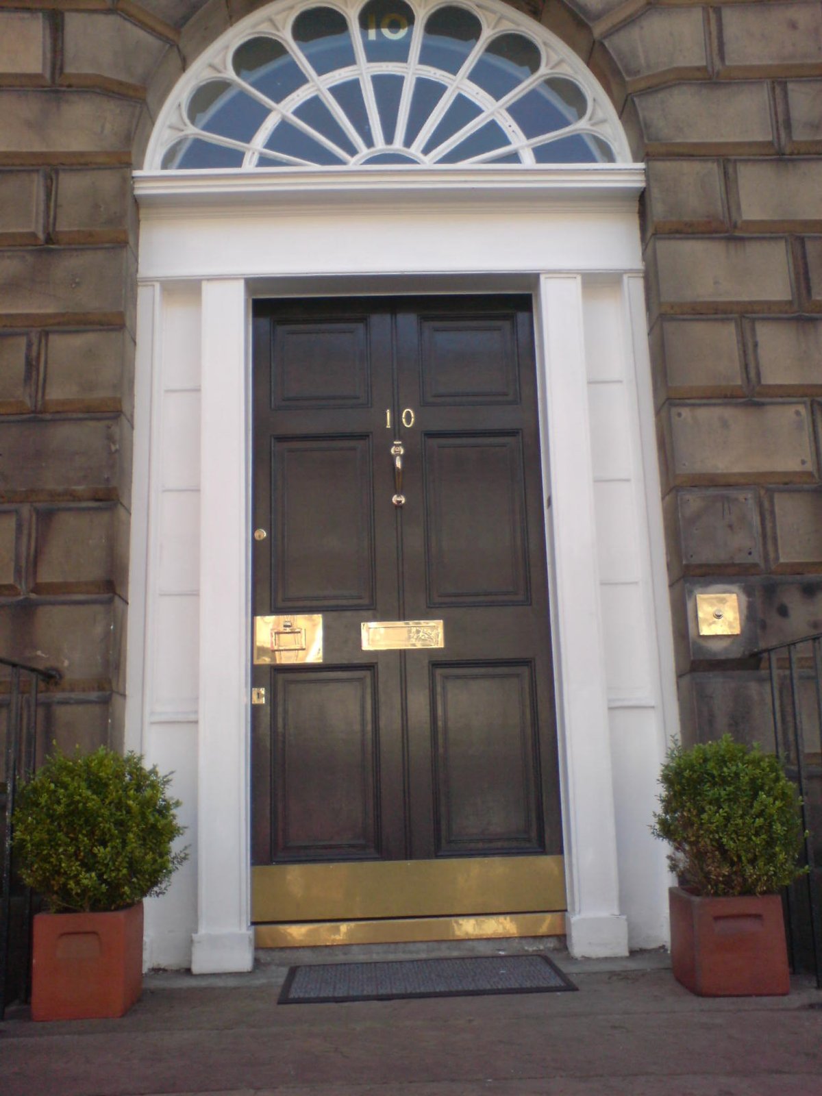 A black Georgian front door with a fanlight in Edinburgh&rsquo;s New Town