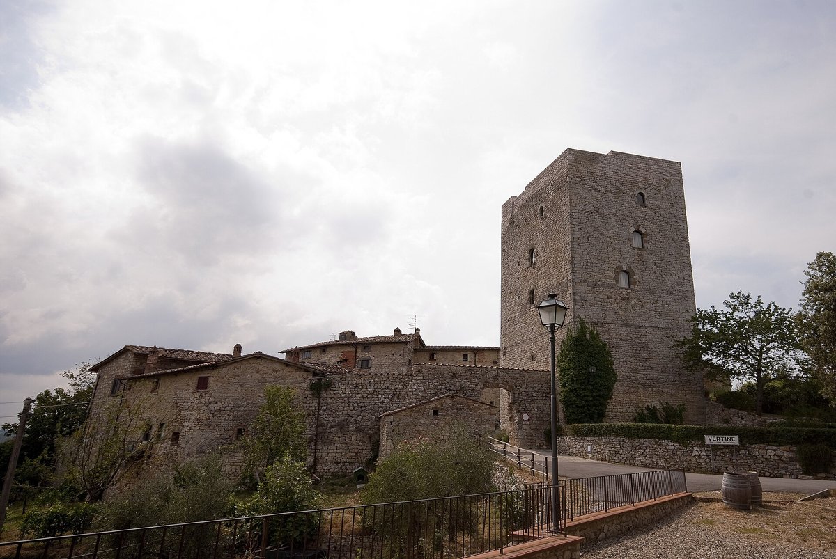 A small walled village with its tower in the Chianti hills