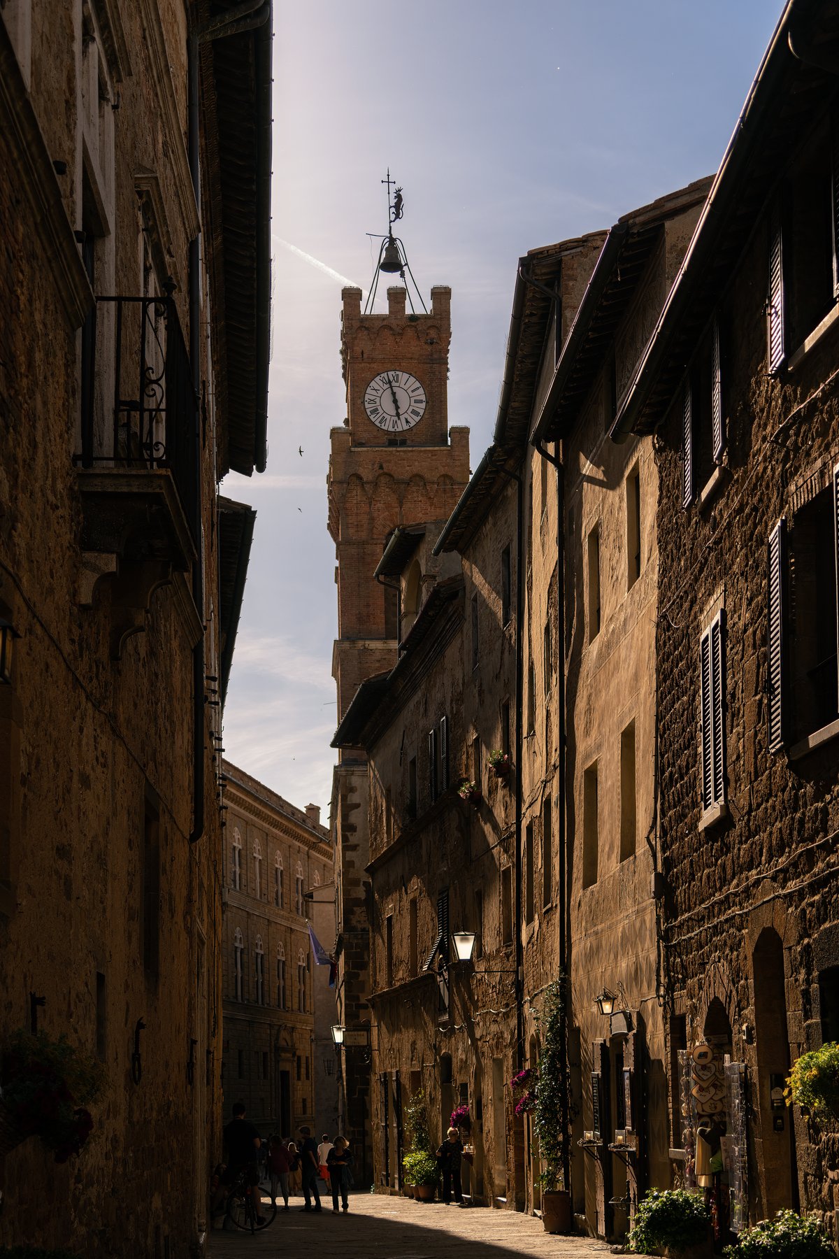 The Corso il Rossellino, the main street of Pienza, running toward the town-hall clock tower
